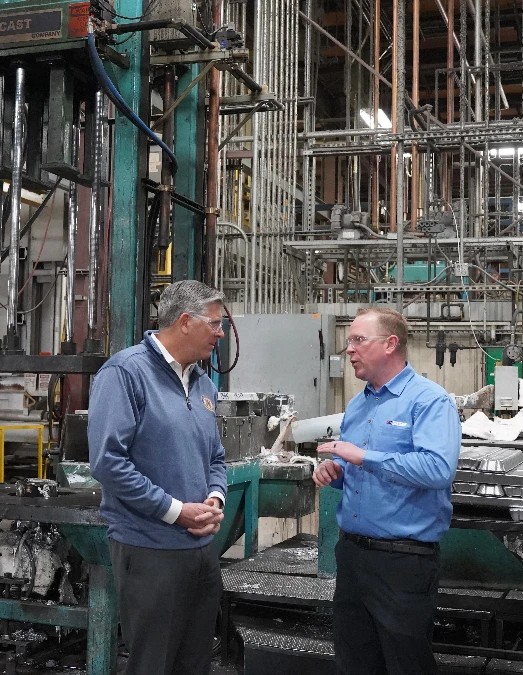 Alcast Company team discussing Mitchener molding at the press