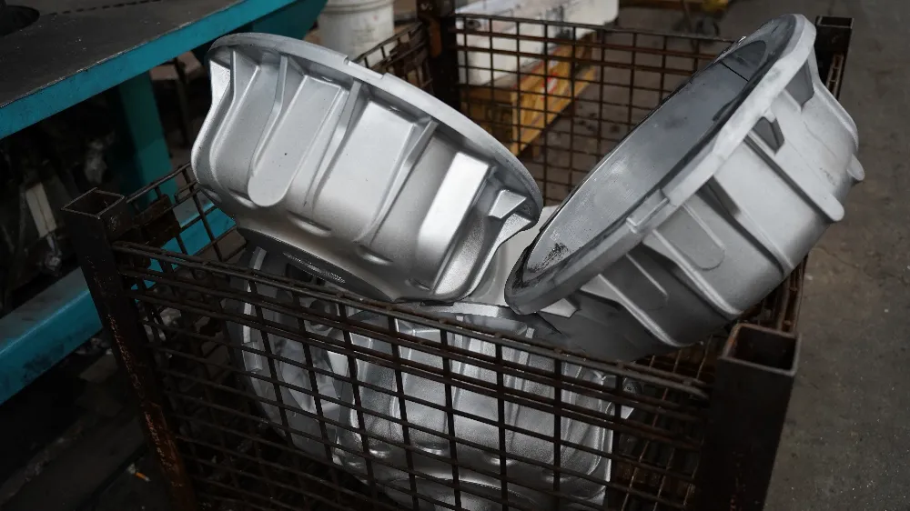 Industrial equipment gearbox housings in a wire basket